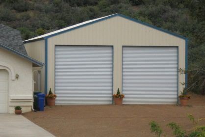 Steel Garage Next to Stucco House